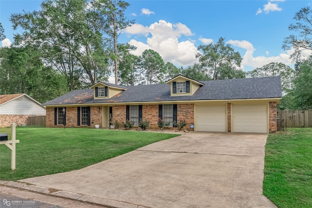 view of front facade with a garage and a front yard