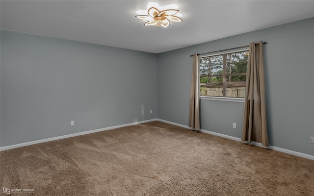 unfurnished room with carpet flooring