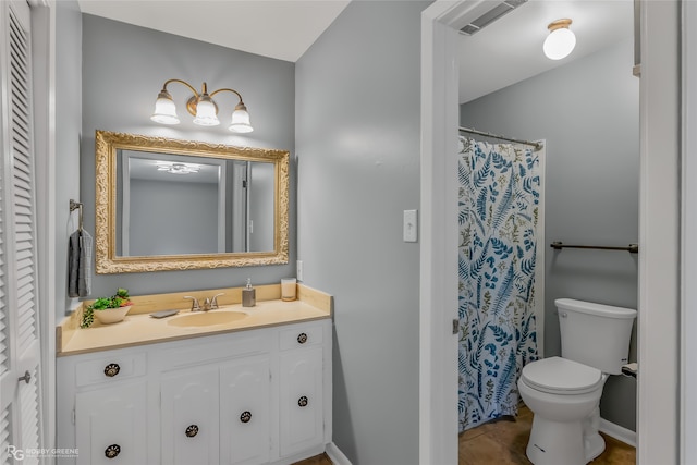 bathroom featuring vanity and toilet