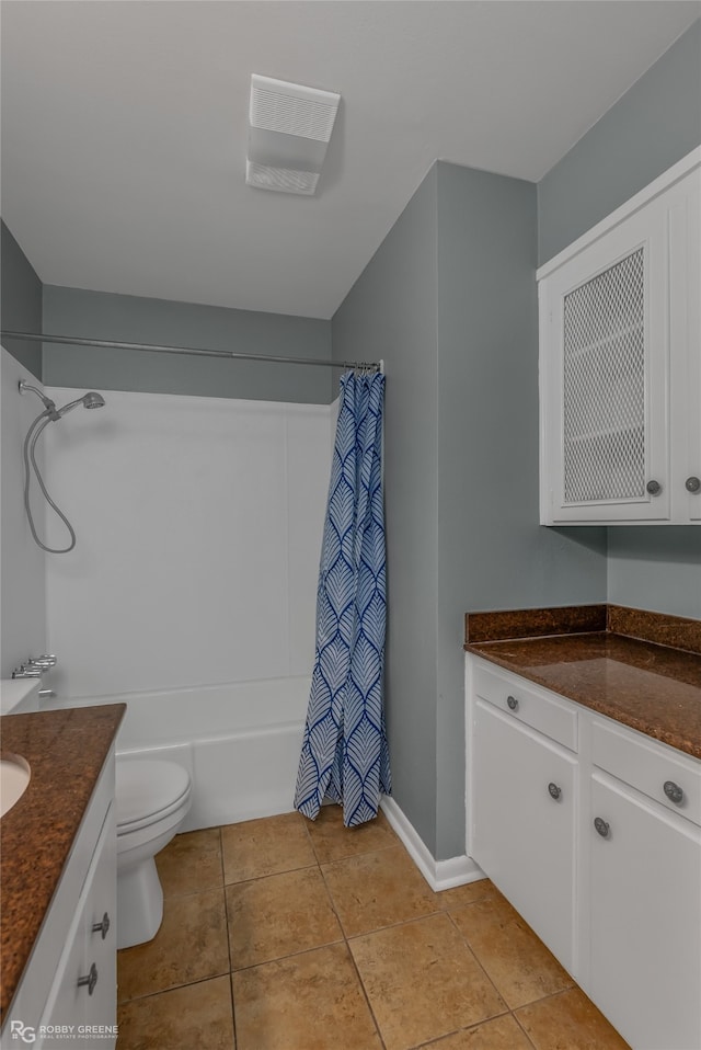 full bathroom featuring shower / bath combination with curtain, tile patterned flooring, vanity, and toilet