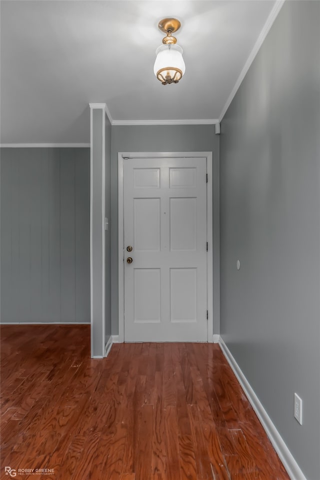 entryway featuring ornamental molding and hardwood / wood-style flooring