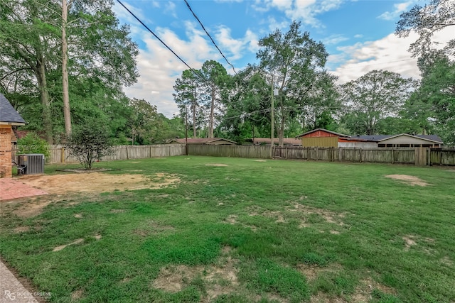 view of yard featuring central AC