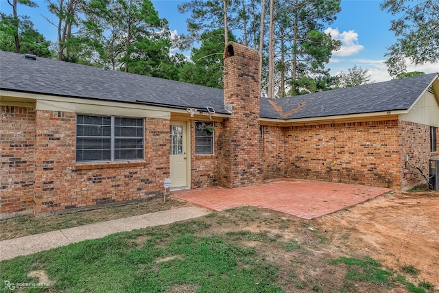 back of property with a patio and cooling unit