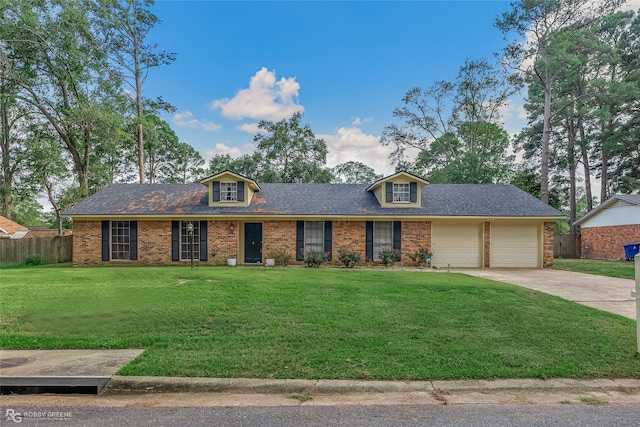 view of front facade featuring a garage and a front lawn