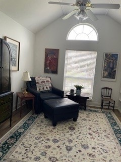 sitting room featuring ceiling fan, hardwood / wood-style floors, and vaulted ceiling