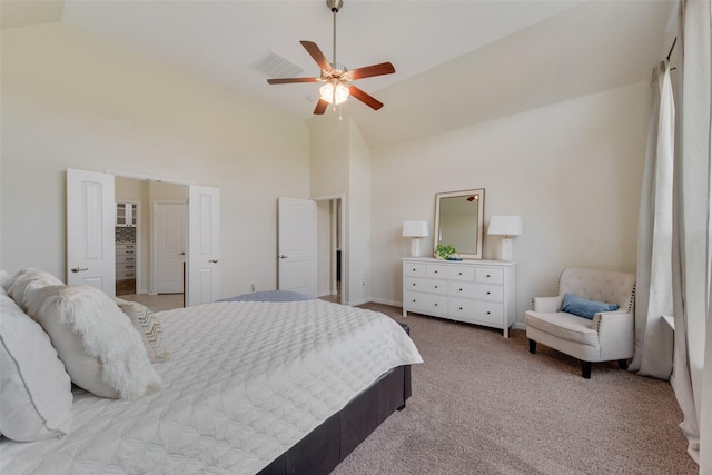 carpeted bedroom featuring ceiling fan and high vaulted ceiling