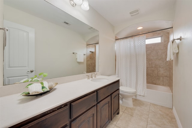 full bathroom with tile patterned floors, vanity, toilet, and shower / bath combination with curtain