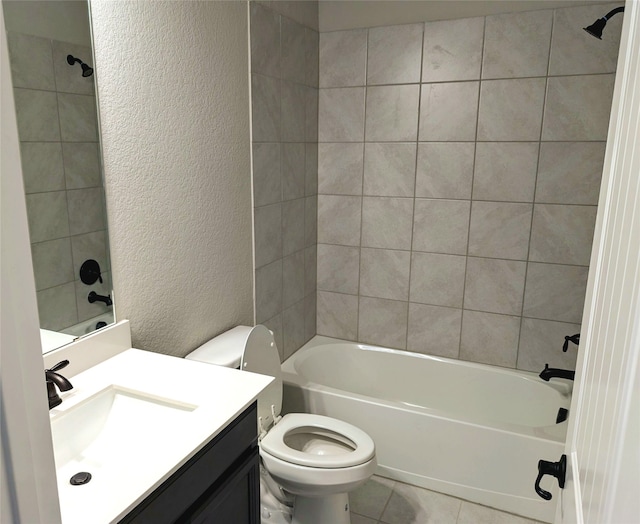 full bathroom with tiled shower / bath, vanity, toilet, and tile patterned flooring