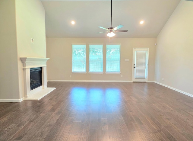 1516 Fairweather Way, Forney, TX 75126 - unfurnished living room with lofted ceiling, a ceiling fan, dark wood-type flooring, a glass covered fireplace, and recessed lighting