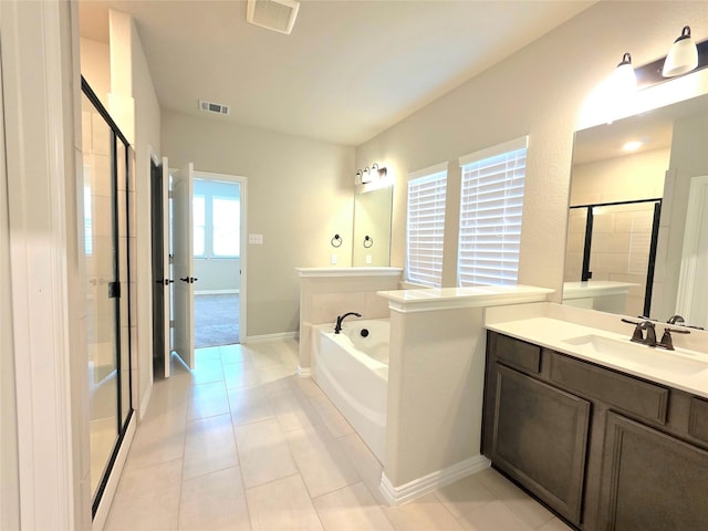 1516 Fairweather Way, Forney, TX 75126 - full bathroom featuring a stall shower, a garden tub, vanity, and tile patterned flooring