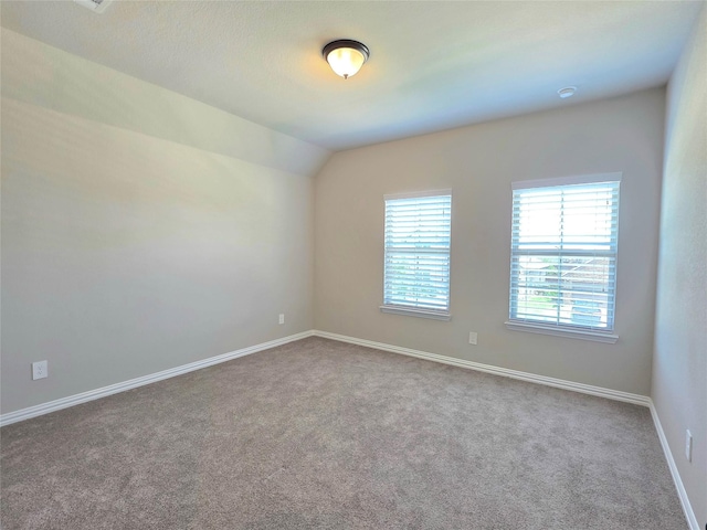 1516 Fairweather Way, Forney, TX 75126 - unfurnished room featuring carpet floors and vaulted ceiling