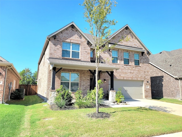 view of front of house featuring a front yard and a garage