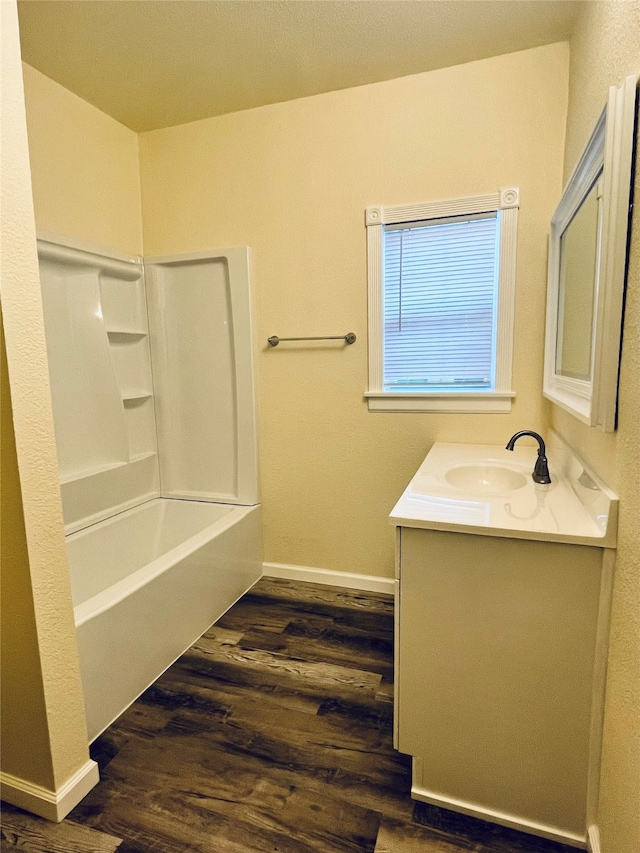 bathroom featuring vanity, shower / bath combination, and hardwood / wood-style flooring