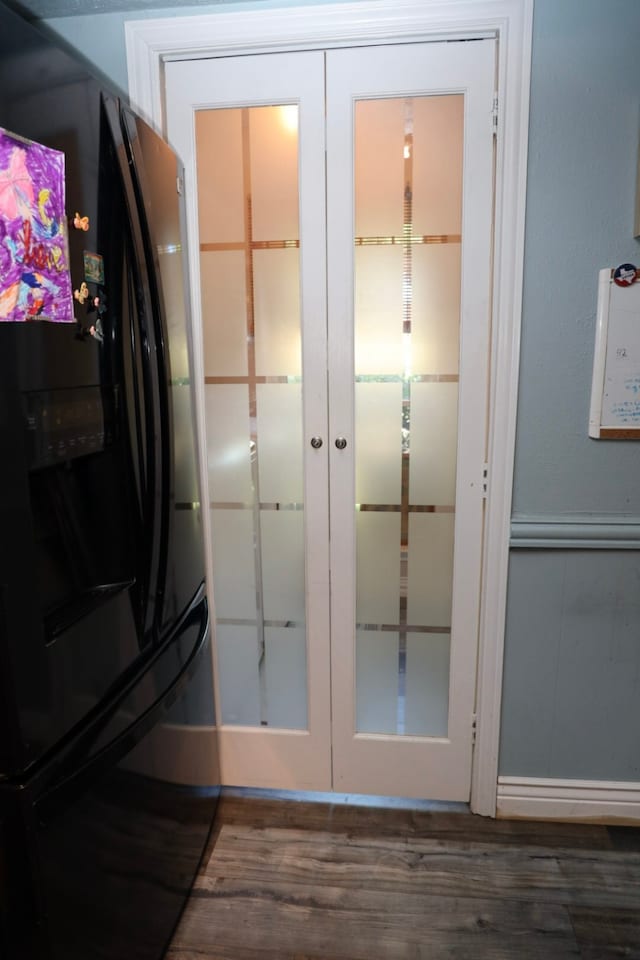 doorway to outside with french doors and dark hardwood / wood-style flooring