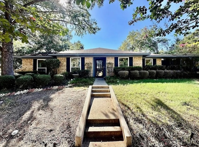 ranch-style home with a front lawn