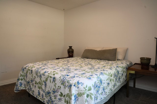 bedroom with dark carpet