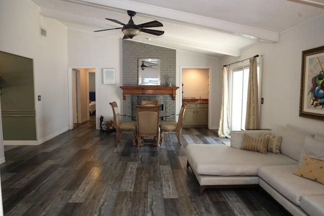 living room featuring vaulted ceiling with beams, dark hardwood / wood-style floors, ceiling fan, and a brick fireplace