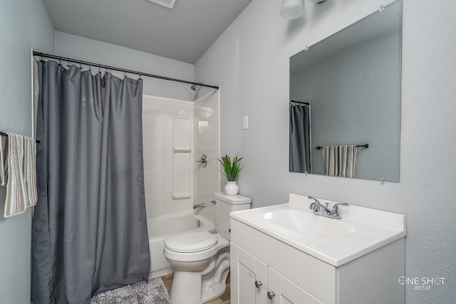 full bathroom with shower / bath combination with curtain, toilet, and vanity