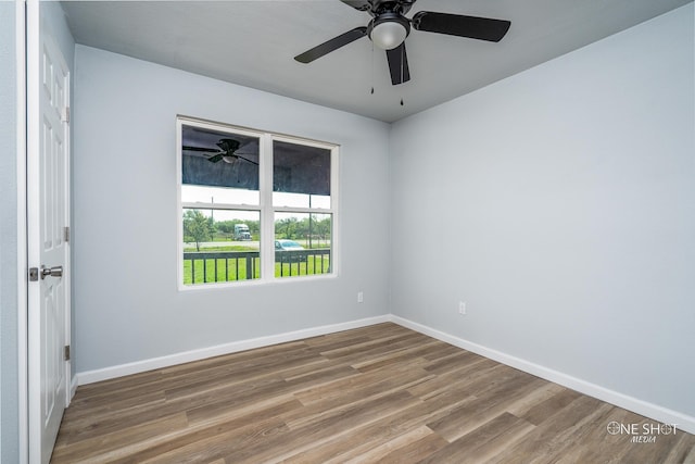 unfurnished room with hardwood / wood-style floors and ceiling fan