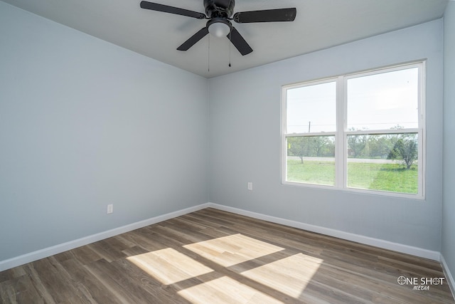 empty room featuring dark hardwood / wood-style floors and ceiling fan