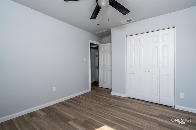 unfurnished bedroom featuring a closet, ceiling fan, and dark hardwood / wood-style floors