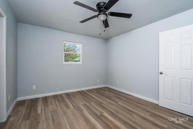 empty room featuring ceiling fan and hardwood / wood-style flooring