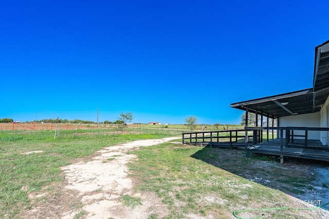 view of yard with a rural view