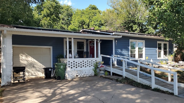 ranch-style house with a garage and a porch