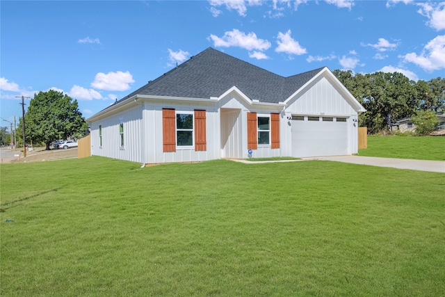 modern farmhouse style home with a front lawn and a garage