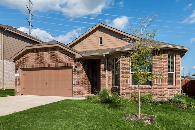 view of front of property with a front yard and a garage