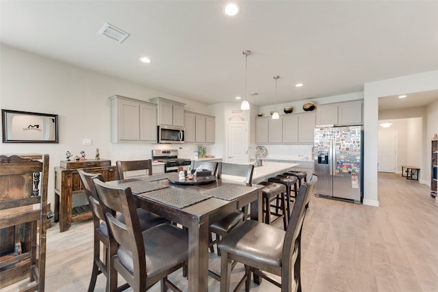 dining area featuring light hardwood / wood-style floors