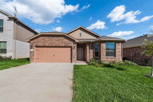 view of front of property featuring a front lawn and a garage