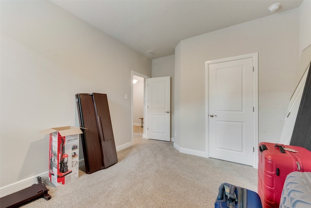 recreation room featuring light carpet