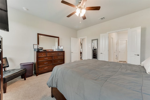 bedroom with ceiling fan and light colored carpet