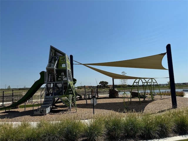 view of playground featuring a water view