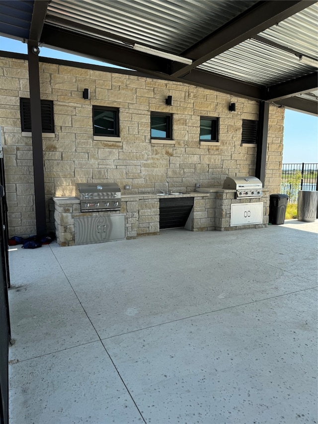 view of patio with area for grilling and grilling area