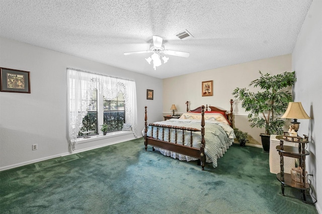 carpeted bedroom with ceiling fan and a textured ceiling