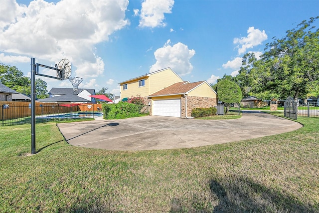 view of home's exterior with a yard and basketball court