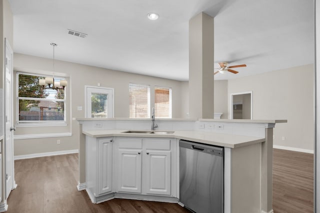 kitchen featuring white cabinetry, dark wood-type flooring, ceiling fan with notable chandelier, pendant lighting, and stainless steel dishwasher