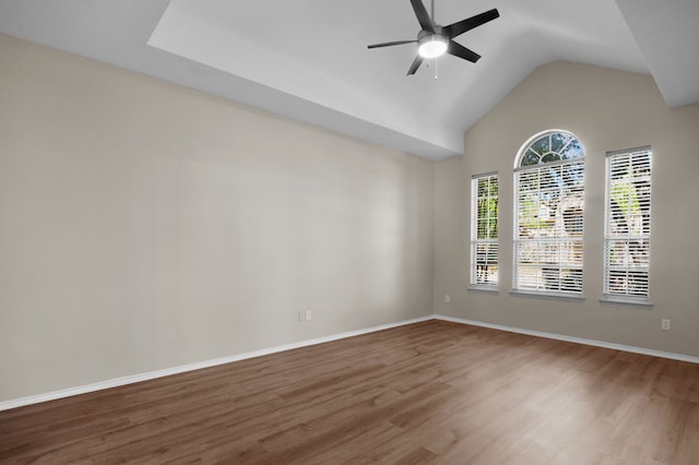 spare room featuring lofted ceiling, hardwood / wood-style floors, and ceiling fan