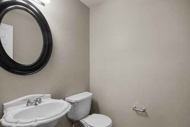 bathroom with sink and toilet