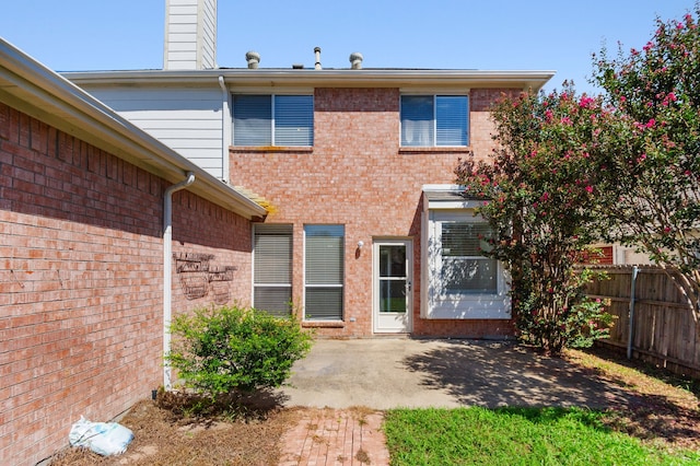 back of property with a patio area