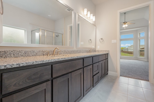 bathroom with vanity, ceiling fan, tile patterned floors, and an enclosed shower