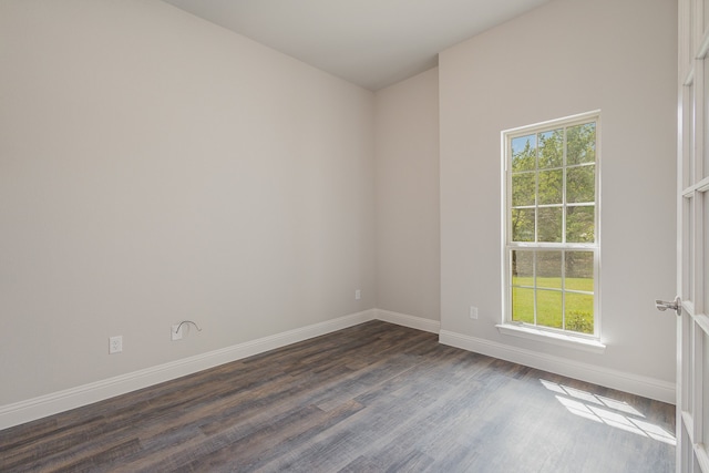 unfurnished room with dark hardwood / wood-style floors