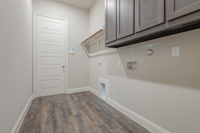 laundry area with washer hookup, dark wood-type flooring, hookup for an electric dryer, cabinets, and gas dryer hookup