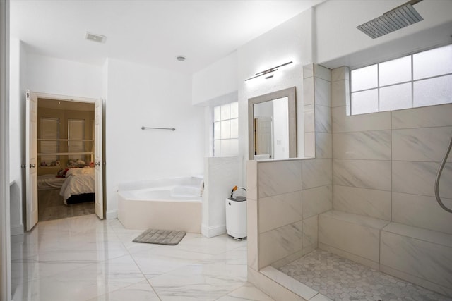 bathroom with separate shower and tub