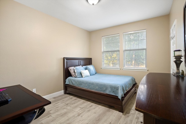 bedroom with light wood-type flooring