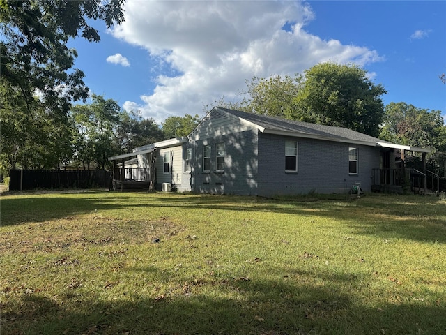 view of home's exterior featuring central AC and a lawn