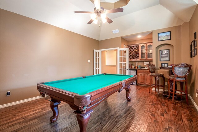 game room with bar, dark hardwood / wood-style flooring, ceiling fan, and billiards