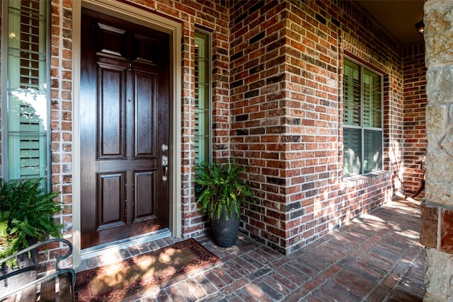 property entrance with covered porch